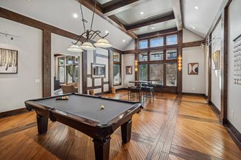 Game area with billiards table and media